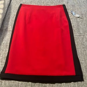 Red pencil shirt, black strip on side, black trim. Size 4